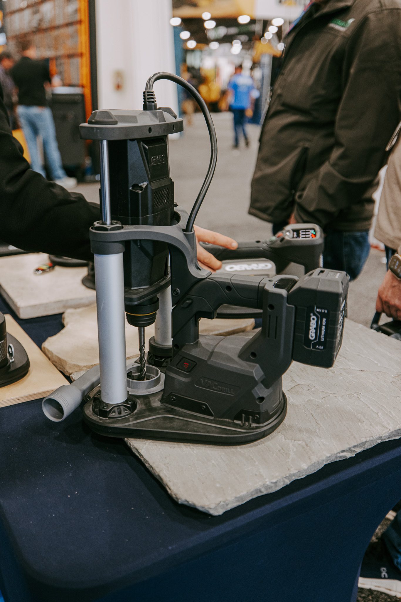 Side view of the VACDRILL integrated vacuum base and rotary hammer