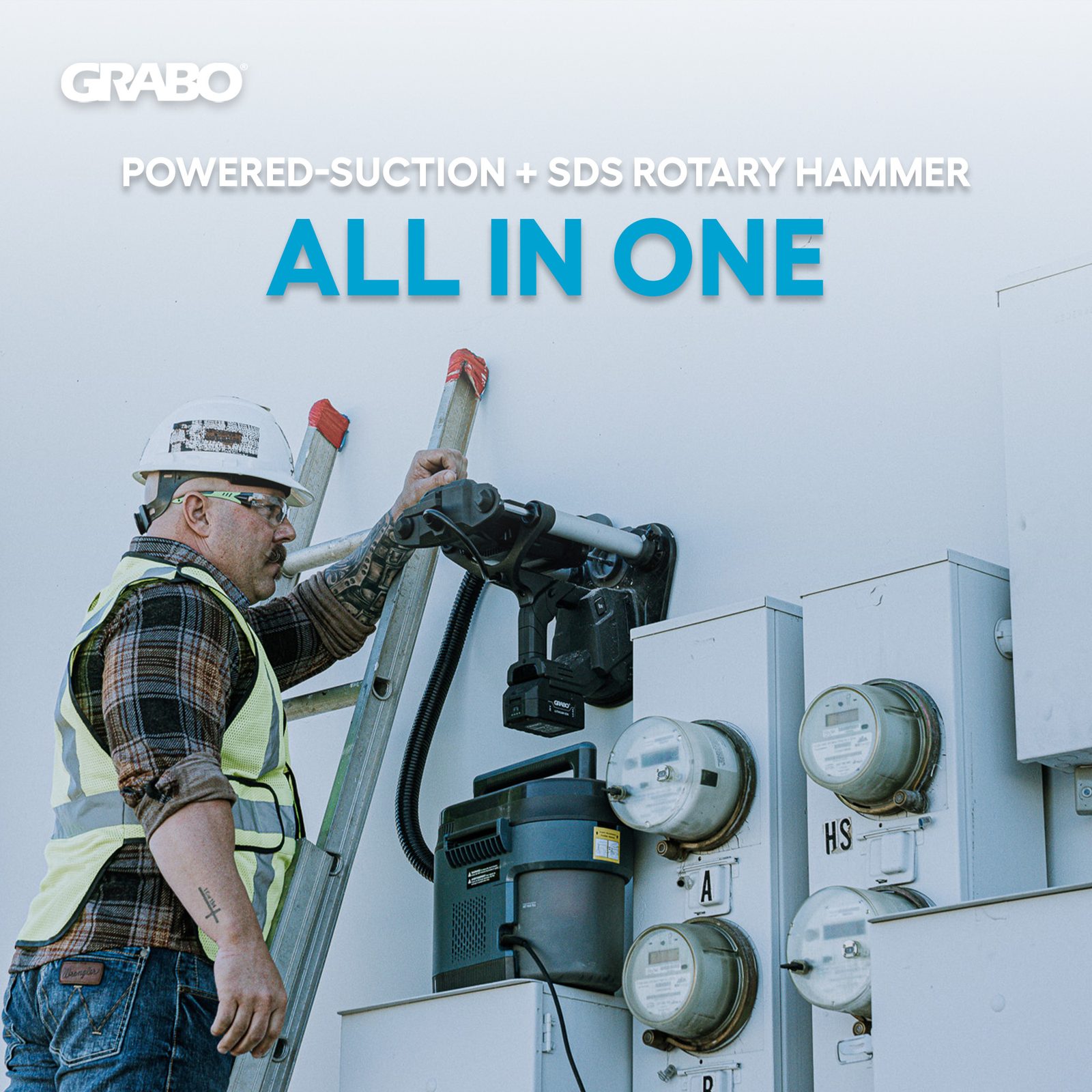 GRABO VACDRILL anchored to a vertical wall while an electrician works beside it